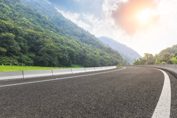 istock country road and mountains with forest in summer 899829068