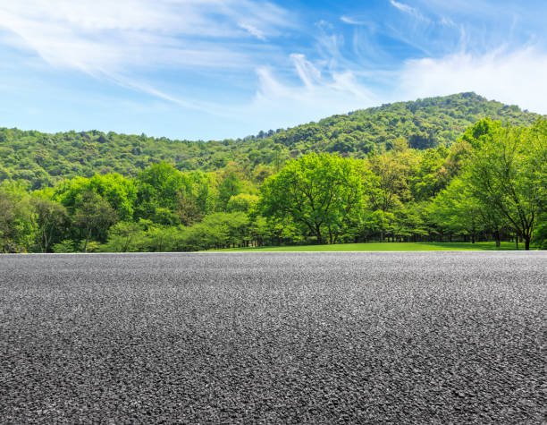 istock country road and mountains with forest in summer 899830522
