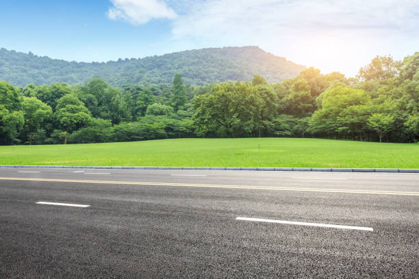 istock country road and mountains with forest in summer 899831282