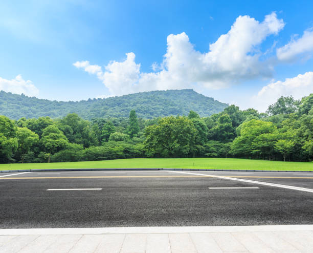 istock country road and mountains with forest in summer 899835938