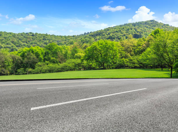 istock country road and mountains with forest in summer 899836220