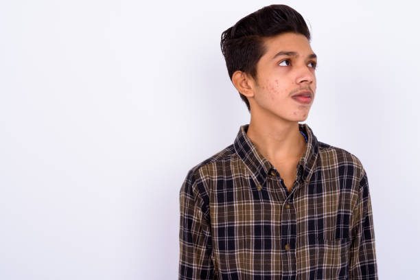 Portrait Of Indian Teenage Boy Against White Background Stock Photo -  Download Image Now - iStock