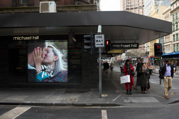 Melbourne, Australia - August 24, 2017: Pedestrians walk past a Michael Hill jewelry store at the corner of Little Collins and Elizabeth Streets in the Central Business District of Melbourne, Australia.