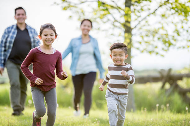 istock Family In A Field 899843976