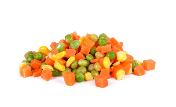 istock Mix of vegetable containing carrots, peas, and corn on white background 899847330