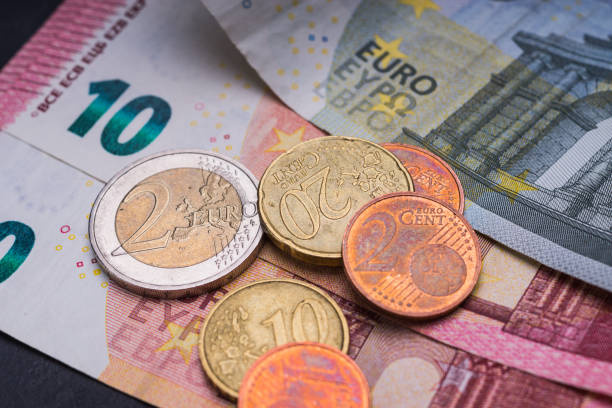 istock Euro banknotes and coins 899860510
