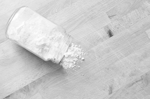 spilled flour on kitchen table, black and white photo