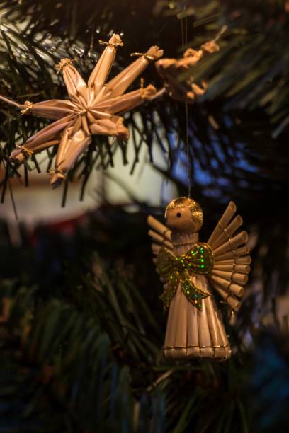 istock beautiful ornaments made of straw on a Christmas tree 899869762