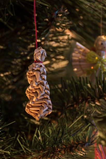 istock beautiful ornaments made of straw on a Christmas tree 899870032