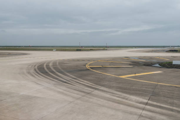 istock empty airport runway on cloudy day 899870234