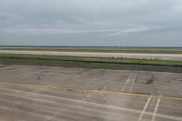 istock empty airport runway on cloudy day 899870240