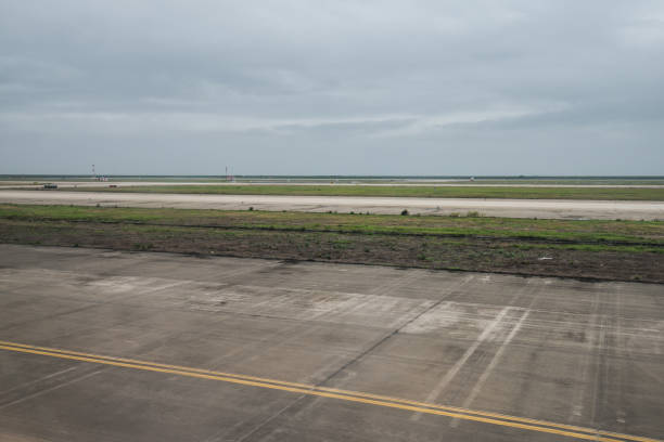 istock empty airport runway on cloudy day 899870258