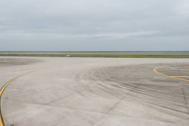 istock empty airport runway on cloudy day 899870260