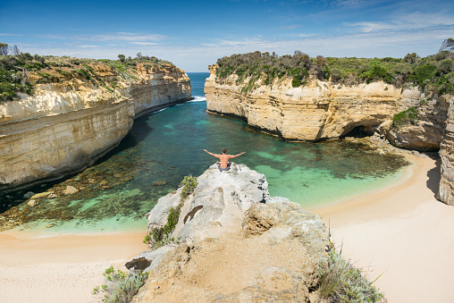 Tourist overlooking the beautiful Loch Ard Gorge, Great Ocean Road, Australia. Nikon D810. Converted from RAW