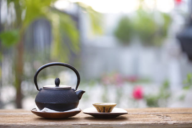 istock Black vintage teapot and cup  at outdoor 899877096