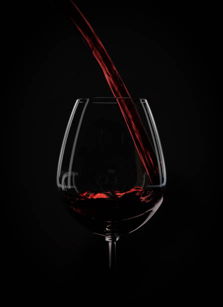 istock wine liquid pouring into glass 899880534