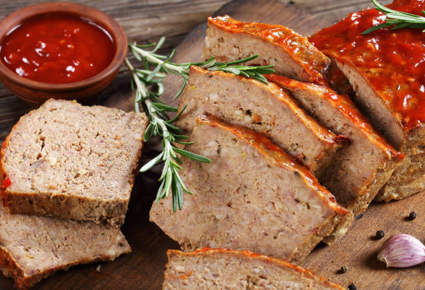 istock close-up of a meatloaf on board 899881116