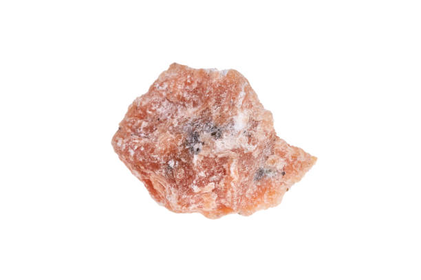 istock Orange calcite mineral stone, isolated on white background 899885040
