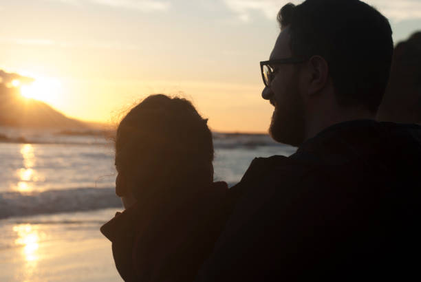 istock Couple in a sunset time 899888600