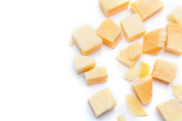 istock Small pieces of parmesan cheese on white background 899889050