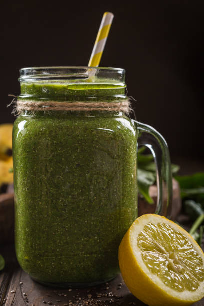 istock Healthy green smoothie with spinach in glass jar 899889636