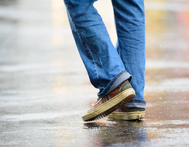 istock Pedestrian crossing rain wet square 899890758