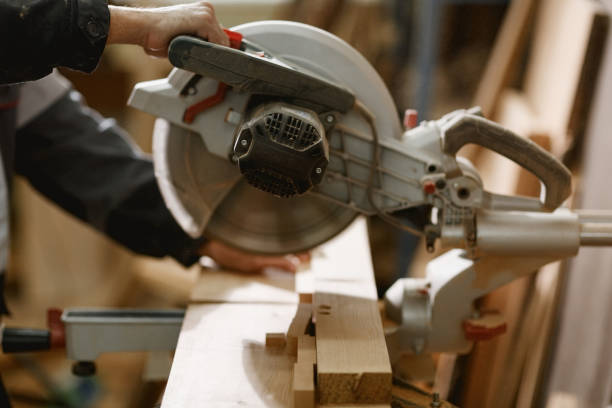 istock A lathe with a sharp round knife behind which a male carpenter works. 899898286