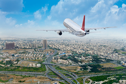 An airplane over tehran city.