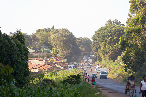 Kikuyu, Kenya - February 8: Rush hour on a main road in Kikuyu near Nairobi, Kenya with traffic and pedestrians passing on February 8, 2013