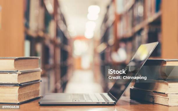 Book And Computer Technology In Library Stock Photo - Download Image Now - E-Reader, University, Library