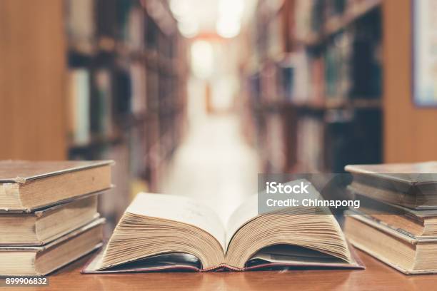 Education Concept With Old Book In Library Stock Photo - Download Image Now - Book, History, Library