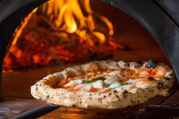 baked tasty margerita pizza near oven - pizzeria imagens e fotografias de stock