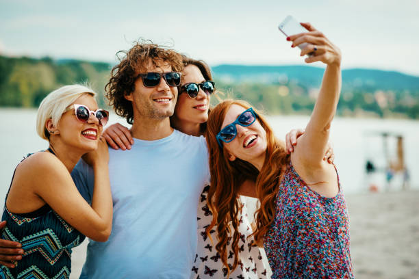 istock Young people gather on the beach and have fun together 899910354