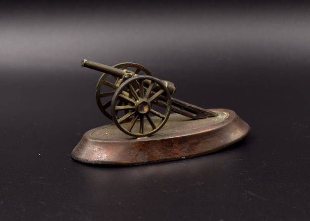 istock Bronze Toy Cannons on Black 899914072