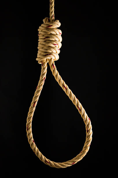 istock Brown rope noose dark and light on black background 899914204