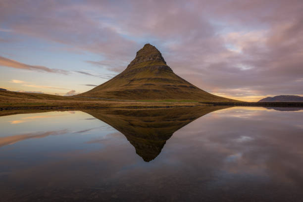 istock Kirkjufell reflecting in a pond during a sunset 899914704