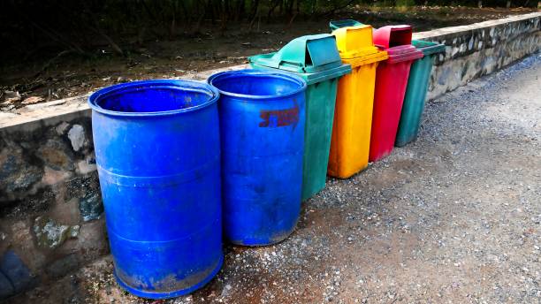 istock Grungy Old Trash Bins in a Row 899914864
