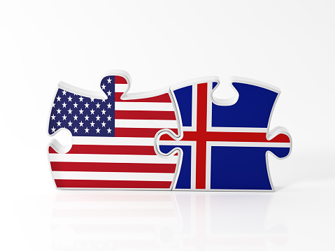 Jigsaw puzzle pieces textured with American and  Icelandic flags on white. Horizontal composition with copy space. Clipping path is included.