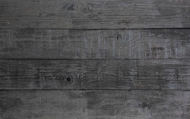 istock black fence, barn wall, old boards, dark wooden background 899923042