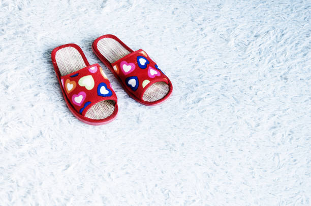 istock Slippers on the floor carpet 899923594