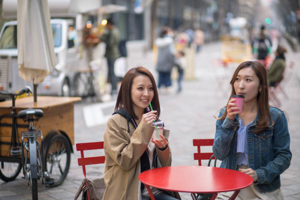 istock Two women taking break at outdoor cafe 899923768