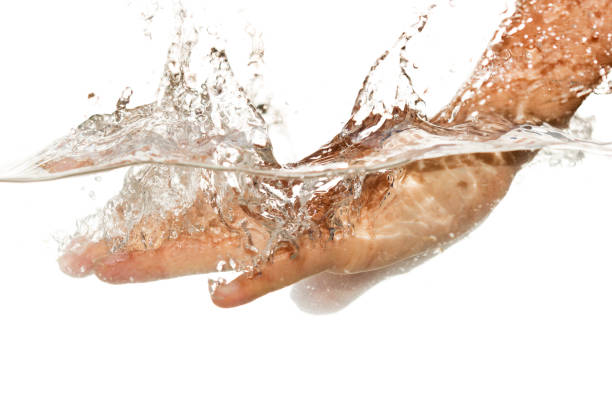 istock hand in water isolated on white background 899926318