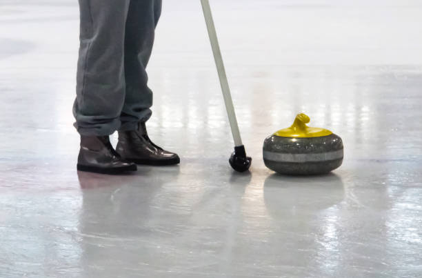 istock Curling, team sports game on an ice platform. 899926532
