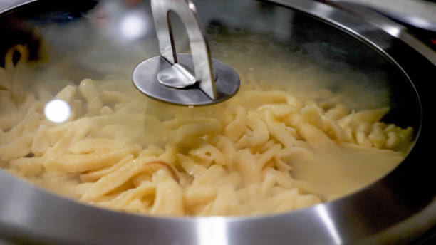 istock Homemade noodles inside pan under misted lid 899926602