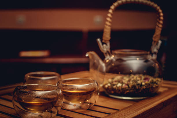 istock Glass chinese teapot with herbs 899927334