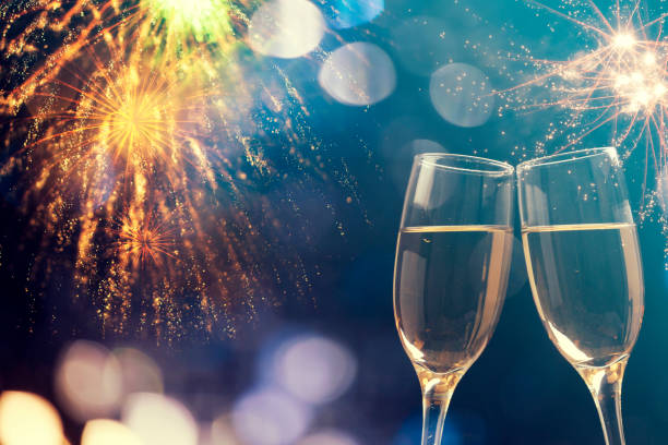 istock Champagne glasses on sparkling background 899927516