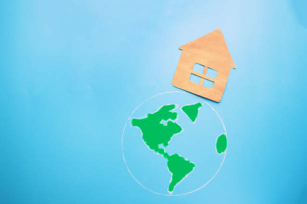 istock paper house on the green earth 899927872