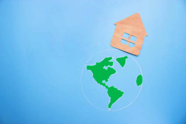 istock paper house on the green earth 899927934