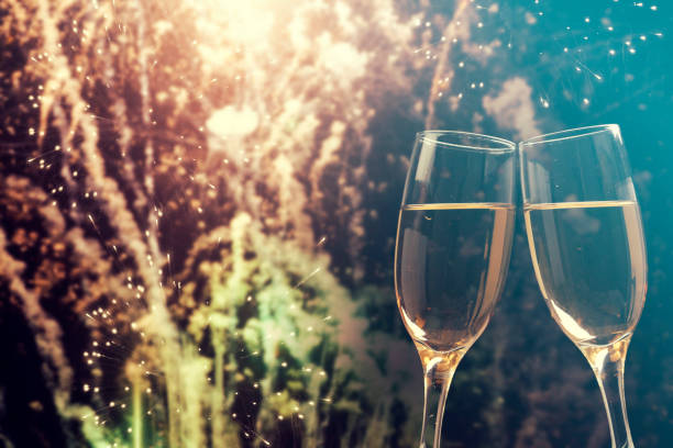 istock Champagne glasses on sparkling background 899932180