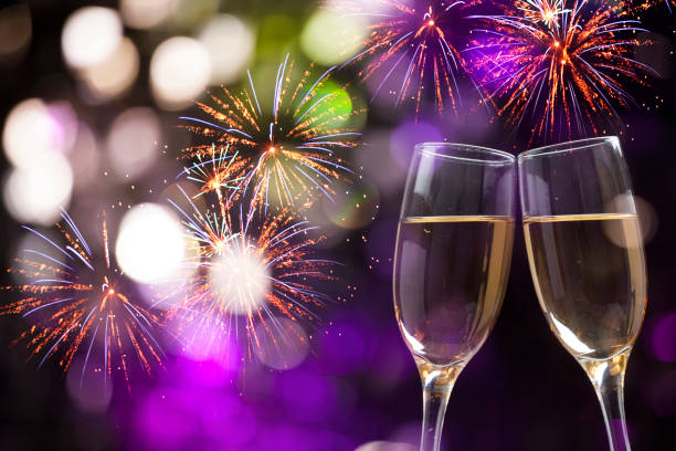 istock Champagne glasses on sparkling background 899934086